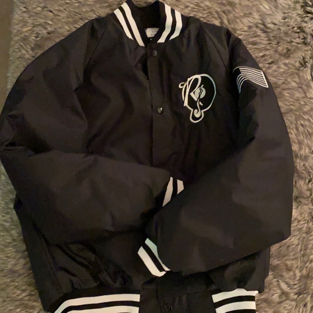 Black and white varsity style nylon concert apparel.